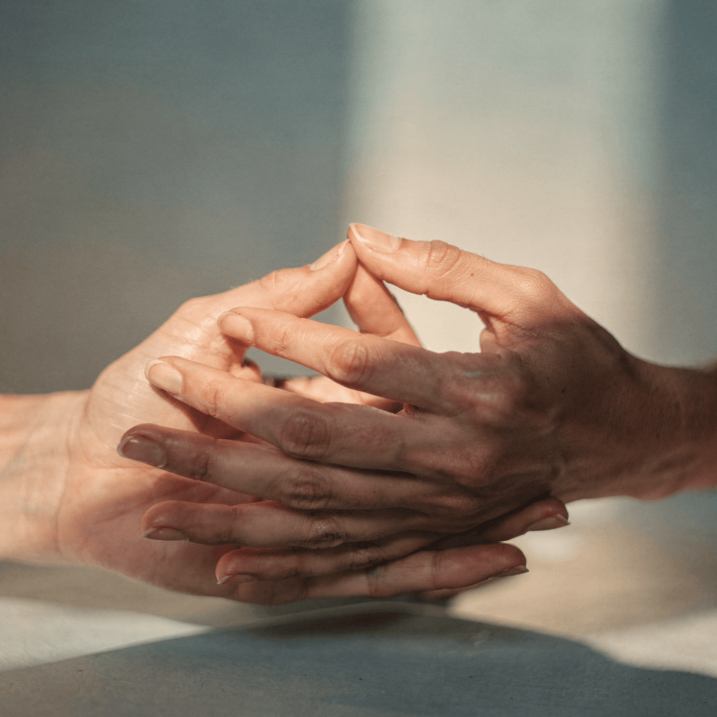 Hands coming together in a gesture of connection and trust