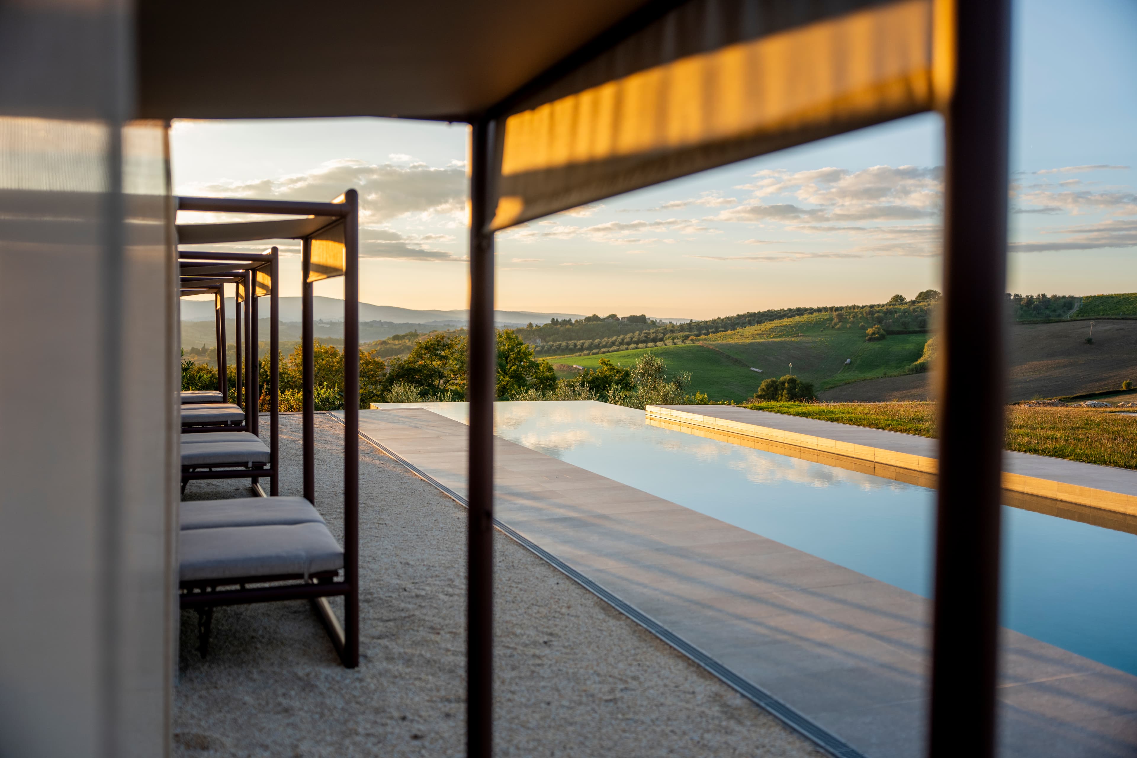Pool cabanas overlooking Tuscan hills